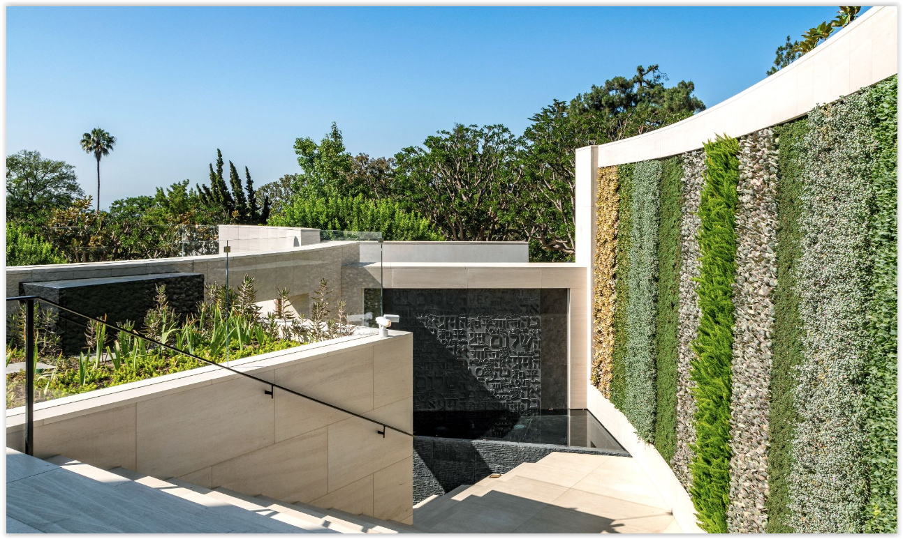 Wall Grand arrival court featuring a dramatic living wall, contemporary architecture, and elegant water feature at a modern Los Angeles private estate.