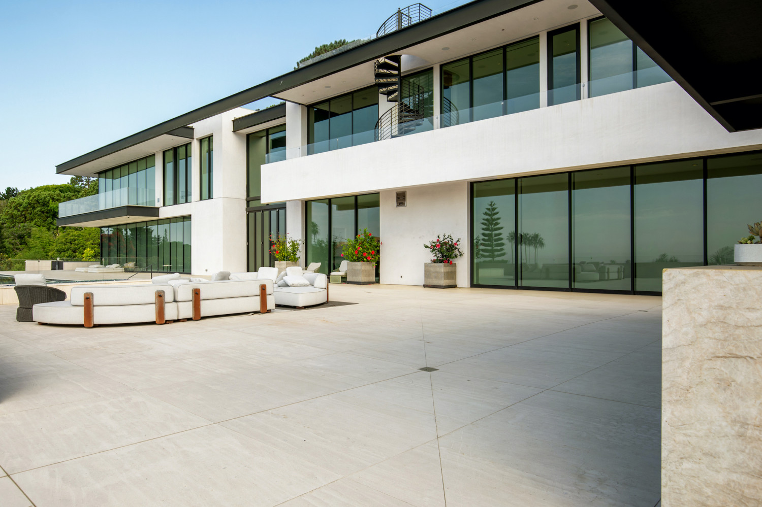 Spacious outdoor entertaining terrace with contemporary lounge seating and seamless indoor-outdoor living.