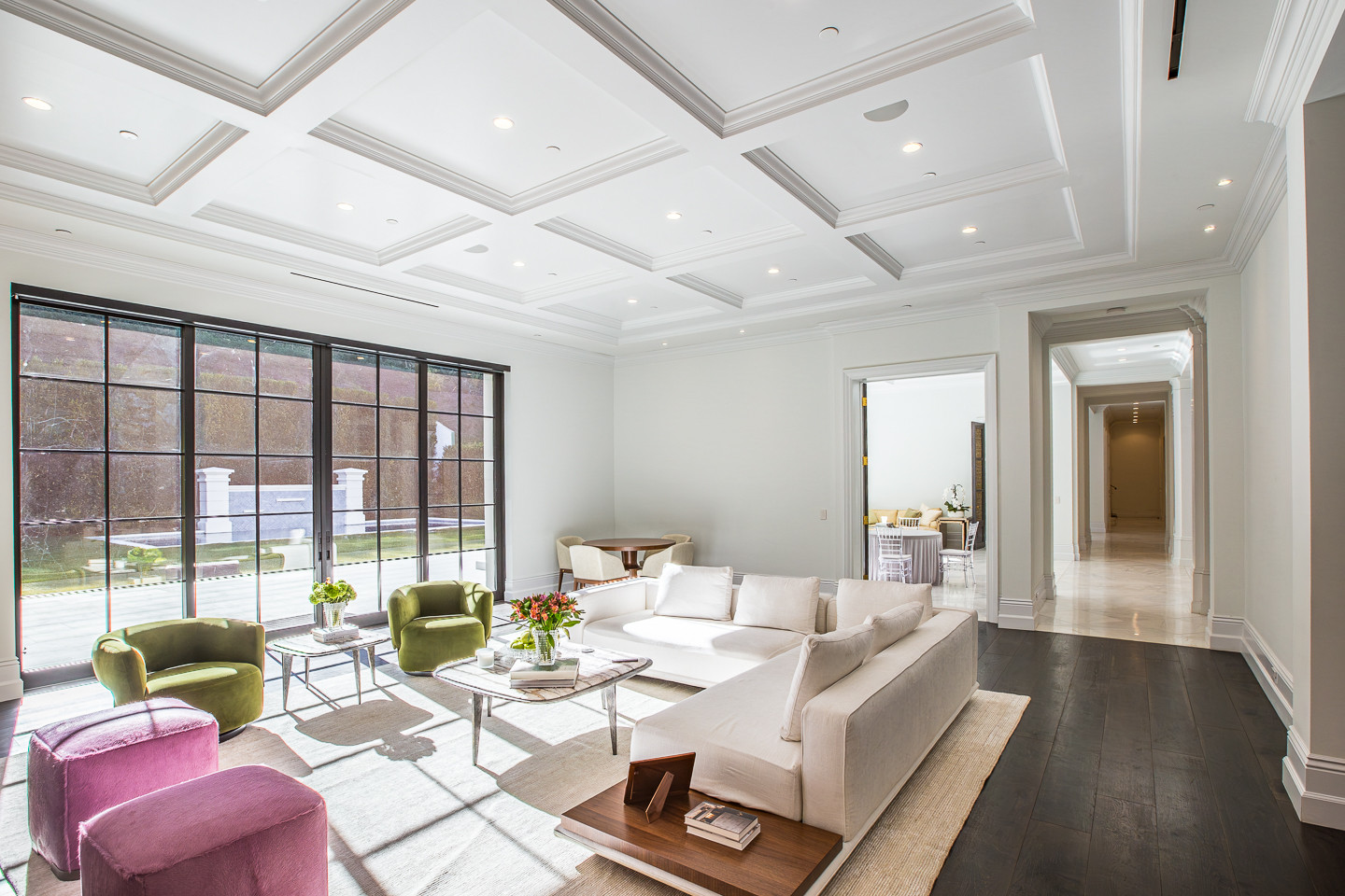 Open-concept living room with natural light and seamless indoor-outdoor access at a Los Angeles private event estate.