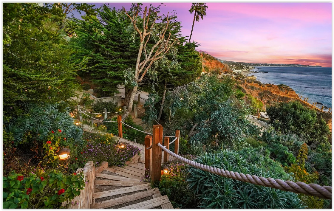 Private steps leading from an elegant Malibu estate to the beach and Pacific Ocean.