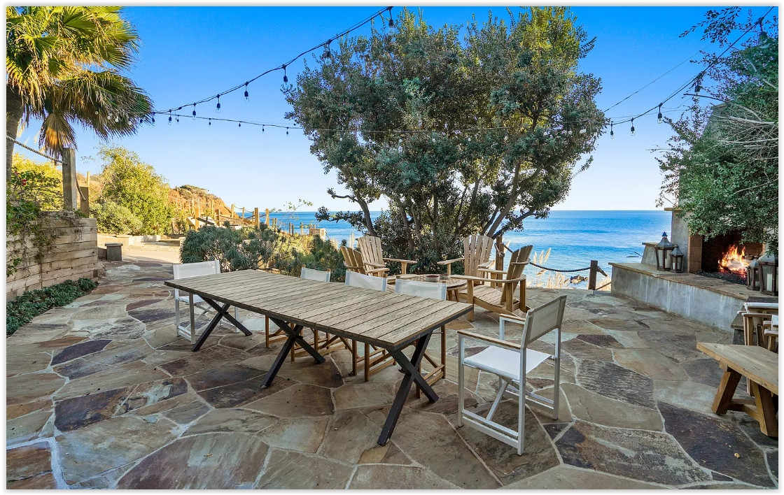 Spacious patio overlooking the Pacific Ocean at an elegant Malibu private estate.