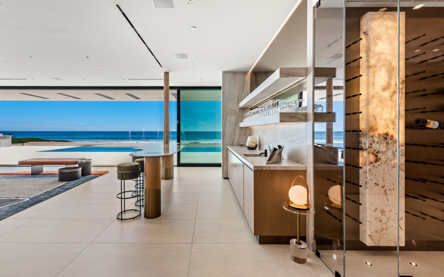 Open-concept living room with panoramic Pacific Ocean views in a modern Malibu beachfront estate.