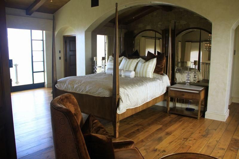 Private primary suite with mountain views and elegant Tuscan-inspired architecture.