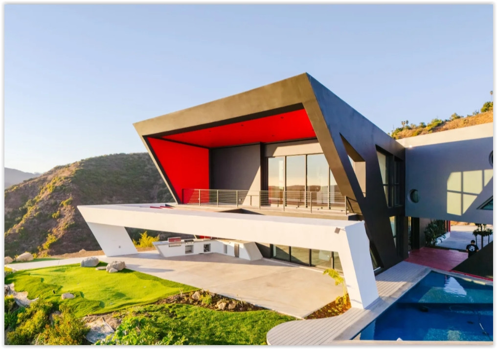 Contemporary Malibu retreat featuring dramatic cantilevered architecture, expansive outdoor living spaces, and panoramic hillside views.