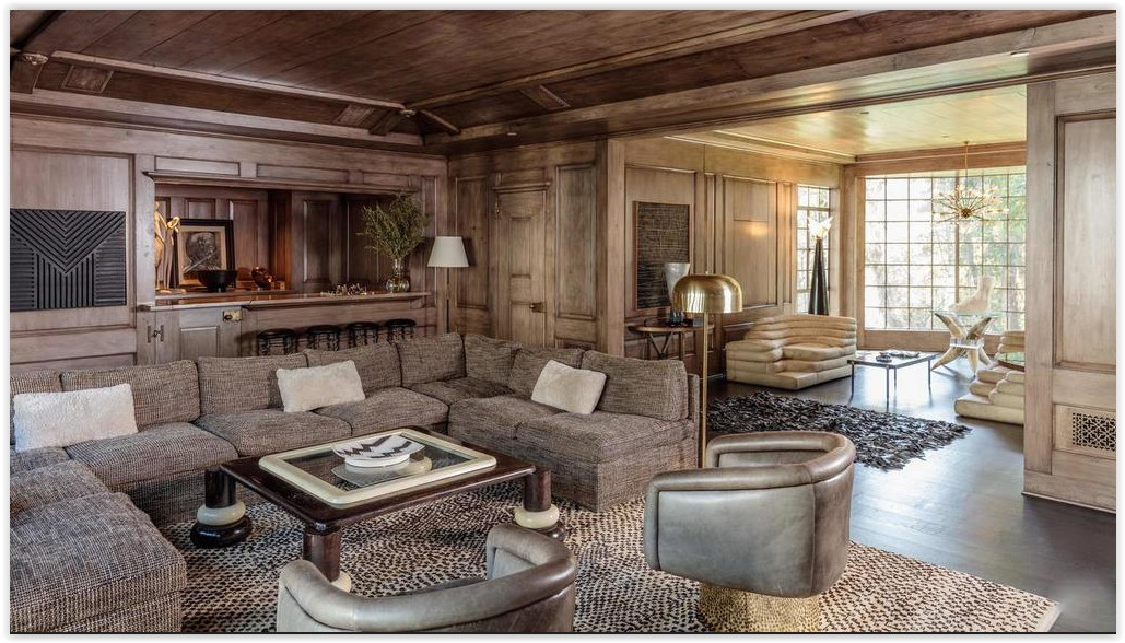 Sophisticated formal living room with fireplace, custom millwork, and garden views inside a Beverly Hills estate.