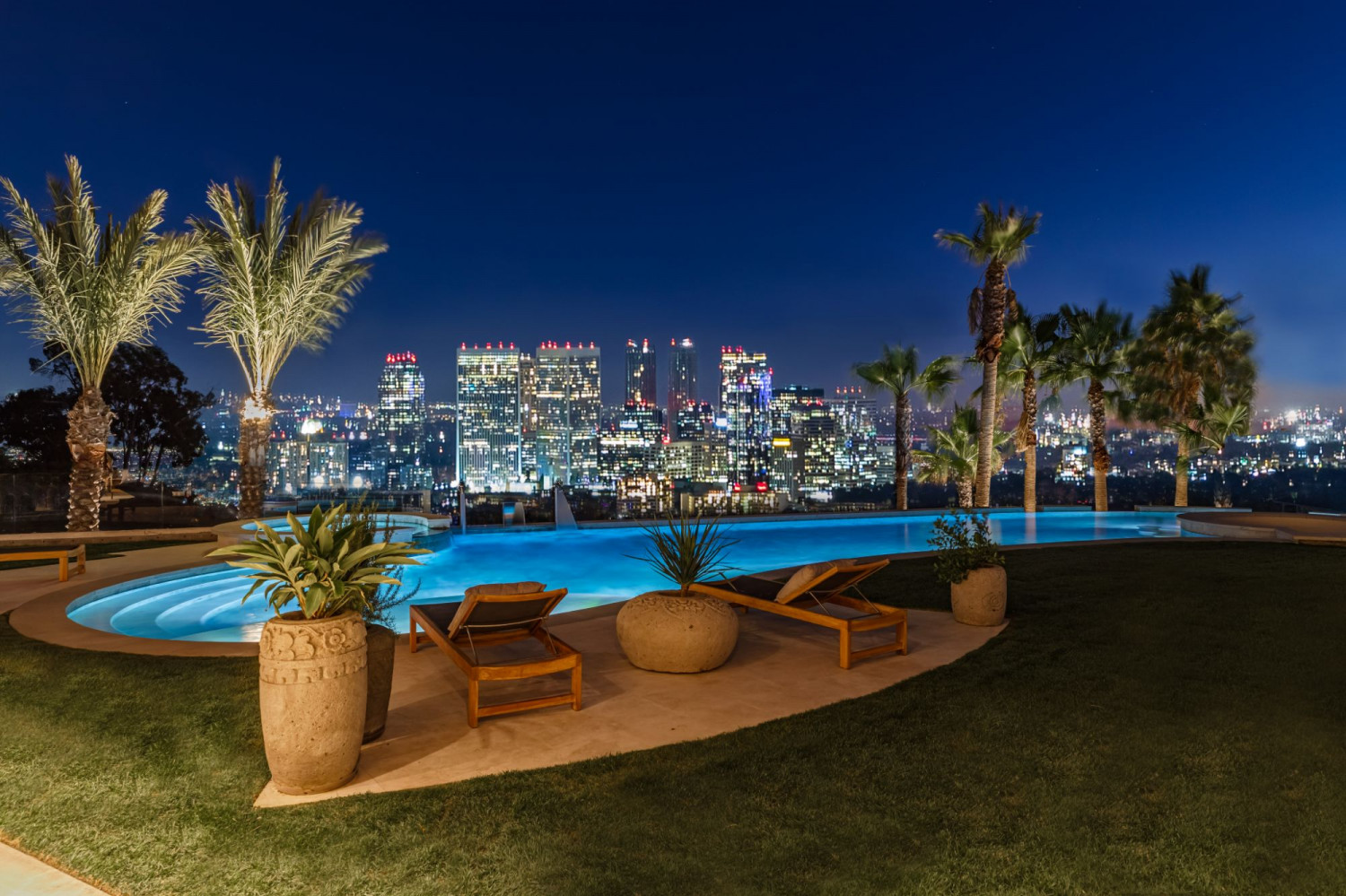 Infinity-style pool overlooking the Beverly Hills skyline with panoramic city views and luxury outdoor entertaining spaces.