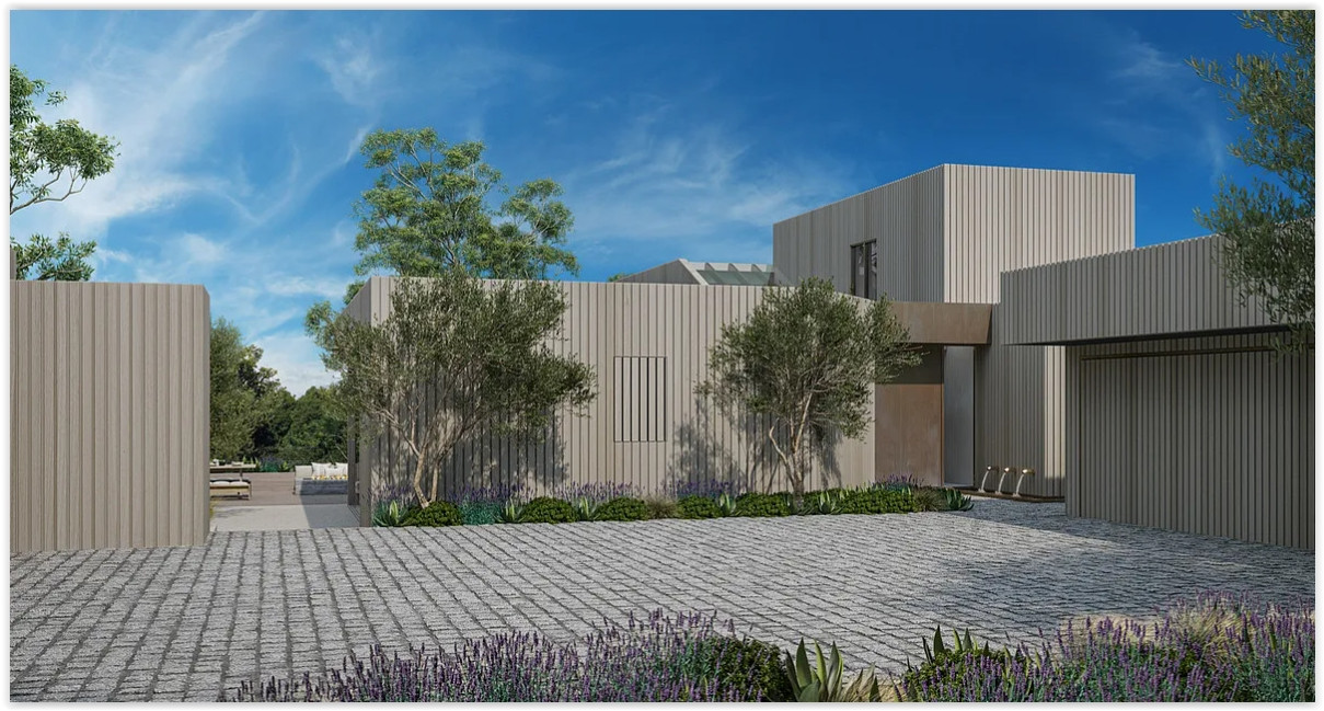 Contemporary entrance with clean architectural lines and landscaped courtyard at a modern Malibu estate.