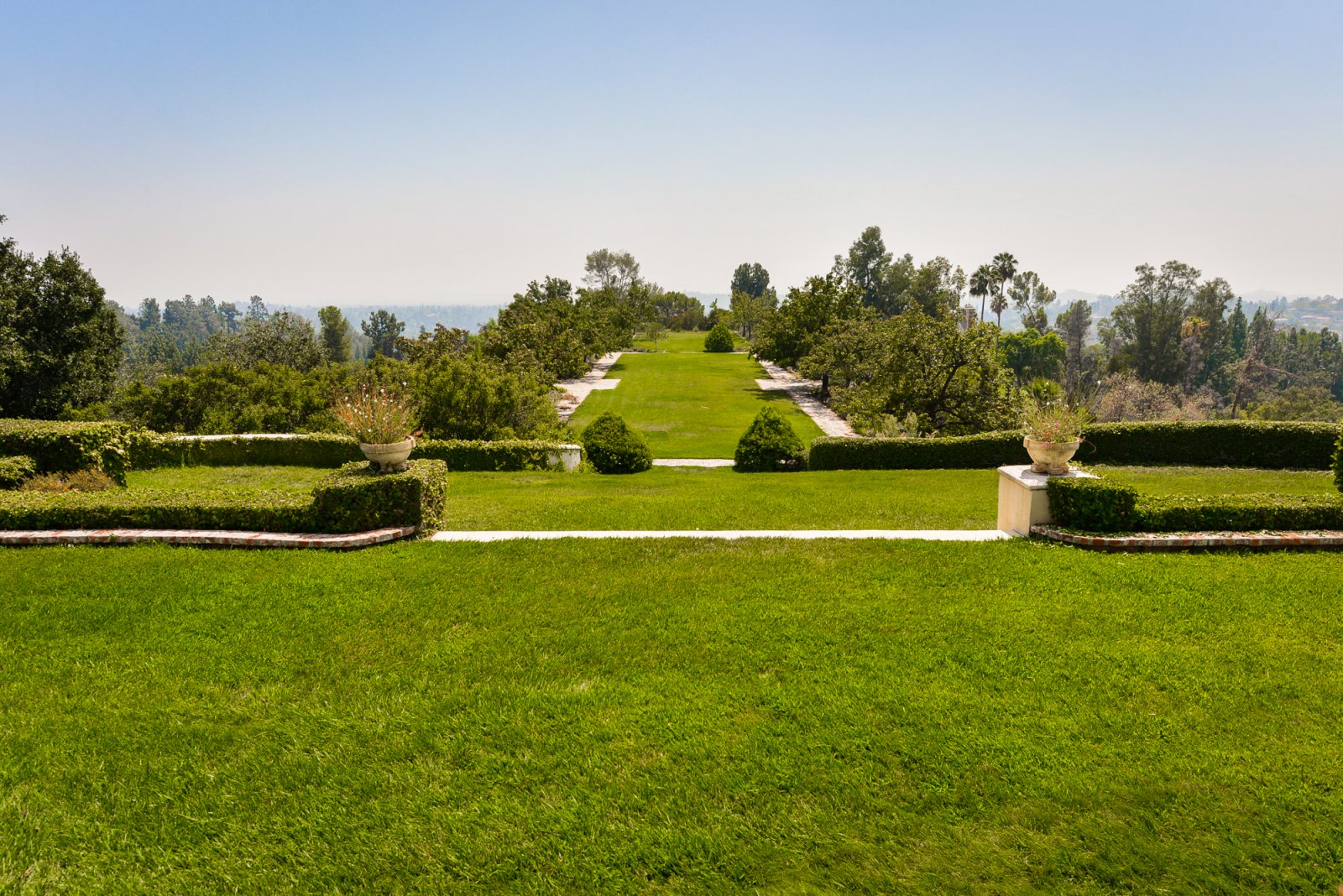 Formal gardens and rolling lawns with scenic views at a private Pasadena event estate.