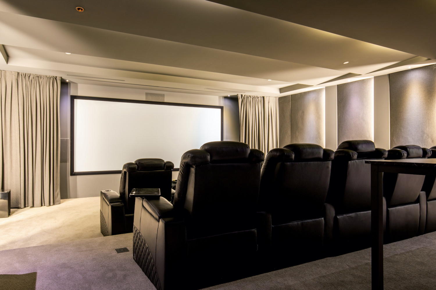Private luxury screening room with theater seating inside a Modern Private Estate Home Events estate.