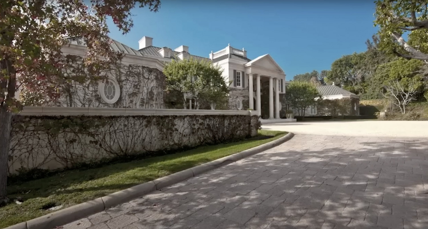 Private driveway leading to a grand luxury estate in Los Angeles.