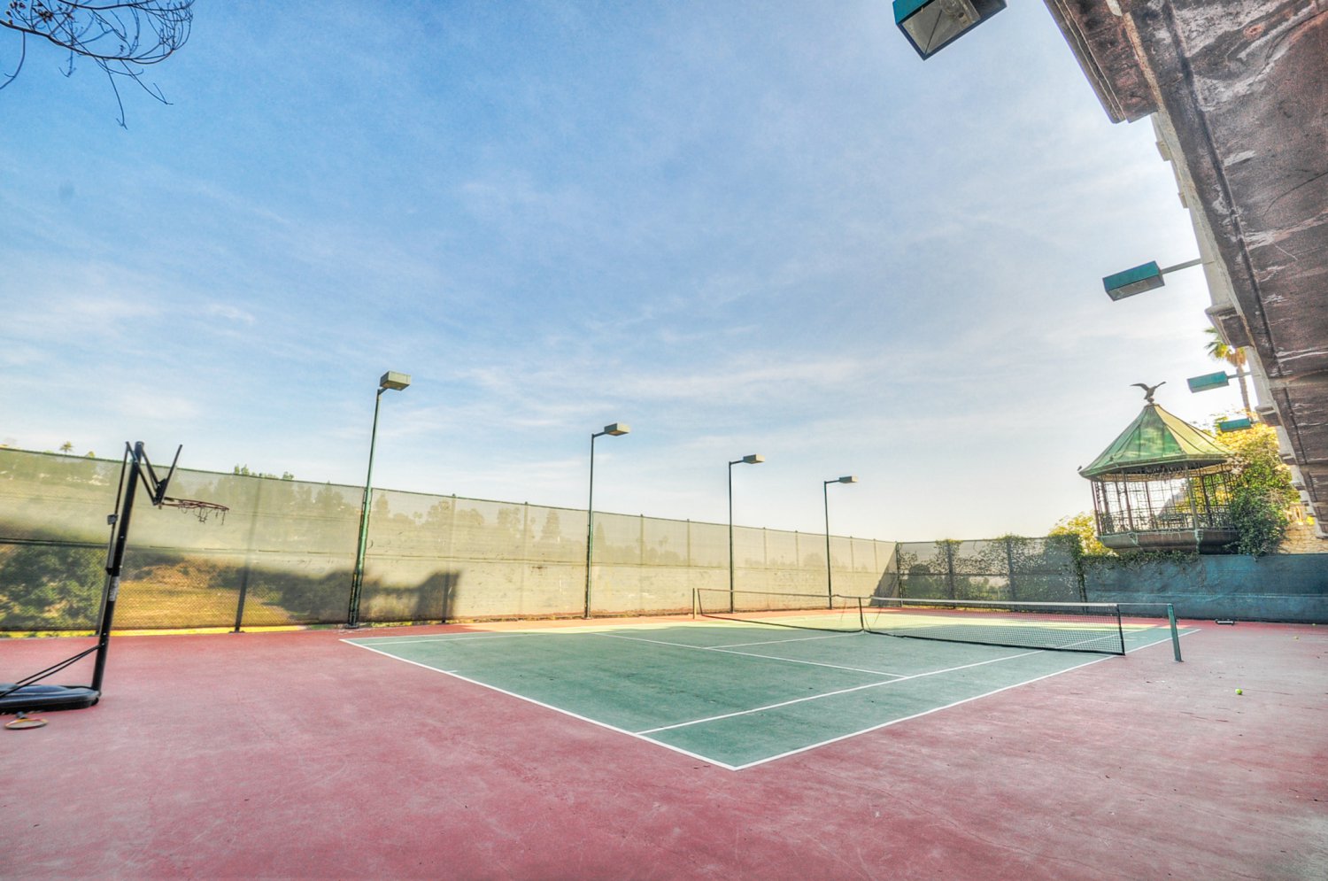Private tennis court at a luxury Beverly Hills estate rental, ideal for corporate retreats, productions, and private events | D645-BH